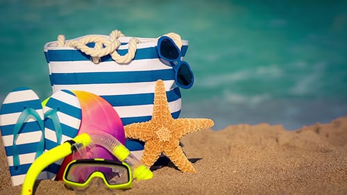Beach Gear on Sand with Ocean Backdrop
