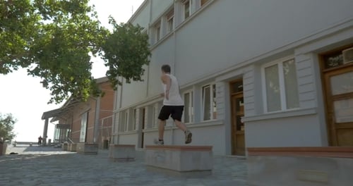 Teenager Performing Parkour In The Street