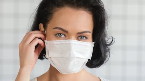 Woman Adjusting Face Mask, Close Up