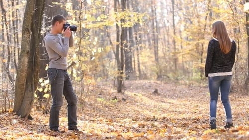 Man Photographing Woman