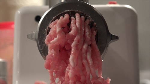 Close Up of Grinding Meat with Machine