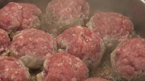 Meatballs Sizzling in Pan, Close Up