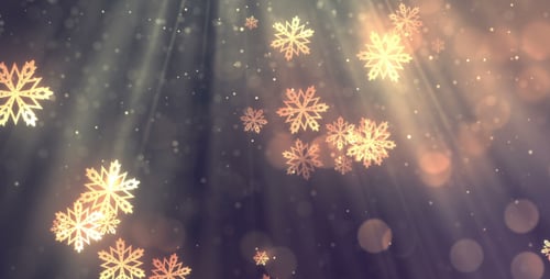 Golden Snowflakes Falling Against Light Rays Christmas Background