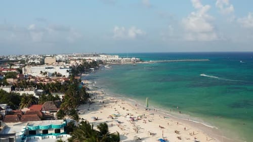 Tourists Sunbathing on the Sandy Beach