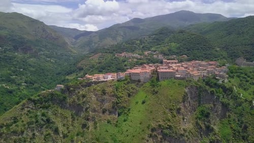 Aerial Medieval Village on Cliff Overlooking Mountain Gorge, Old Town Buildings with Red Tile Roofs