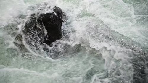 Wild clear mountain river , stream flowing through rocks