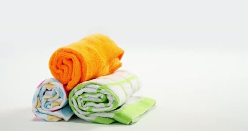 Brightly Colored Rolled Towels Neatly Stacked