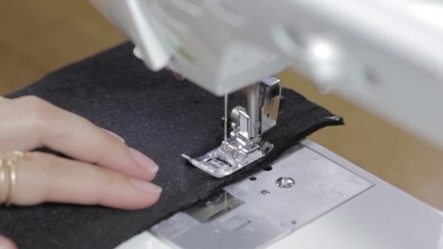 Close Up Sewing Machine Stitching Black Fabric