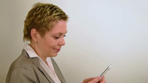 Woman Using Cell Phone Indoors