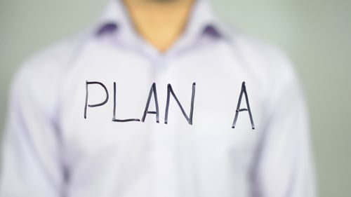 Writing Plan A With Marker on Clear Surface