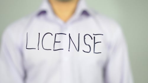 Hand Writing License on Transparent Surface Close Up