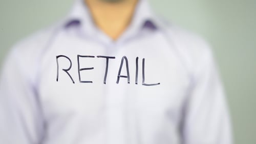 Hand Writing Retail with Marker on Clear Surface