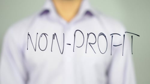 Writing Non-Profit On Clear Surface With Marker