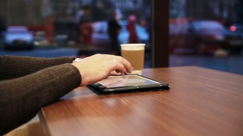 Man Hands Using Tablet Touchscreen In Cafe