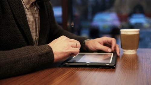 Man Hands Using Tablet Touchscreen In Cafe