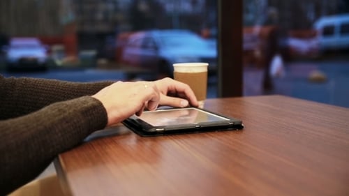 Man Hands Using Tablet Touchscreen In Cafe
