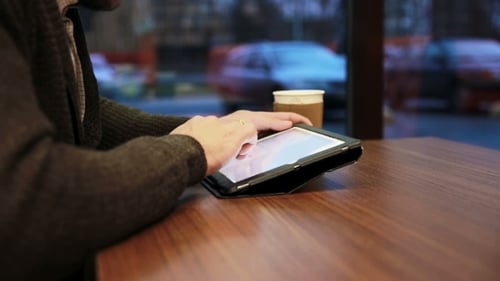 Man Hands Using Tablet Touchscreen In Cafe