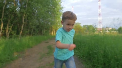 Happy Boy Running In The Park