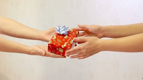 Male Hand Pass The Red Gift Box Female Hands