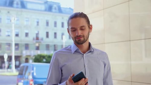 Man Using Mobile Phone, Messaging At City Street