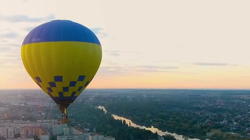 Flight on Hot Air Balloon Towards Sunset Above City, Holiday Entertainment
