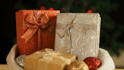 Festive Gifts in Santa Hat on Christmas