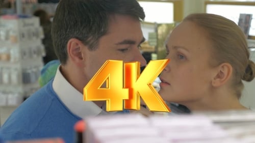 Couple shopping for perfume in department store