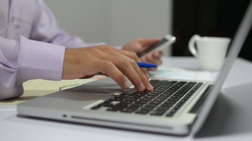 Using Laptop Smartphone for Work on Finance Papers