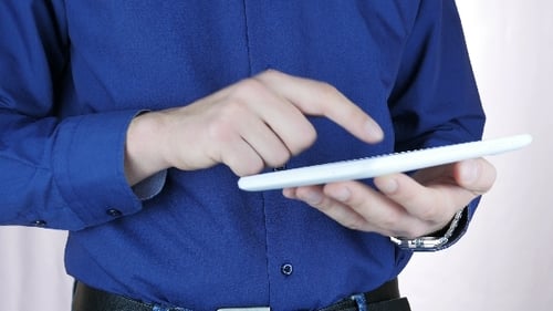 Man Using White Tablet in Close Up Shot