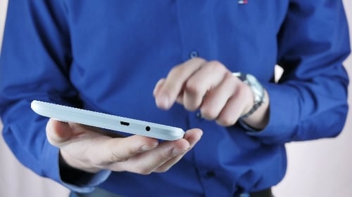 Businessman Using Tablet In Office