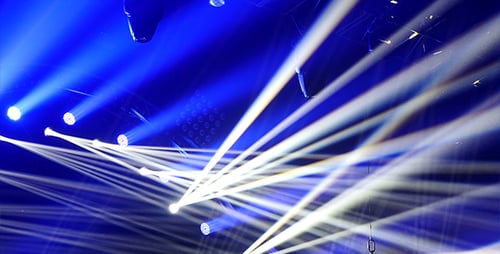 Abstract White Stage Lights Beams Against Blue