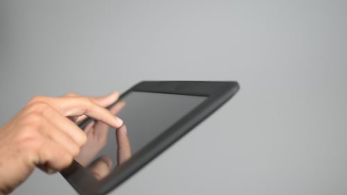 Hand Using Touchscreen Tablet Device Close Up