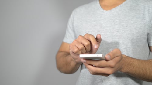 Busy Young Man on Smartphone , Browsing, Scrolling