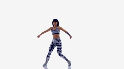 Woman Dancing in Athletic Wear on White Backdrop