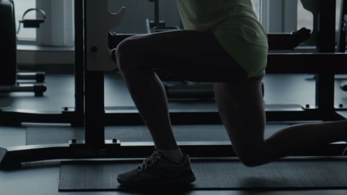 The Girl Does Exercise Jumps In a Gym