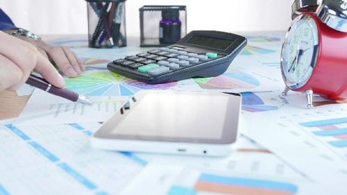 Businessman Using Tablet And Analyzing