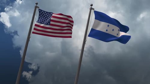 United States and Honduras Flags Waving Against Cloudy Sky