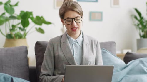 Woman Presents Business Data via Video Conference