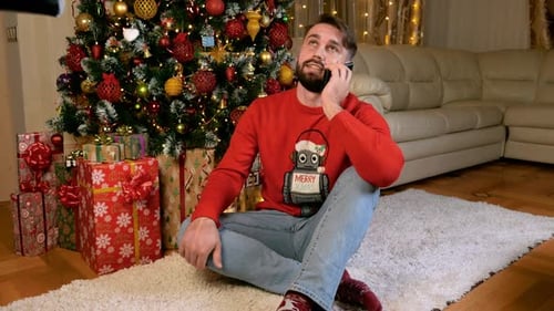 Man Chatting on Phone at Christmas