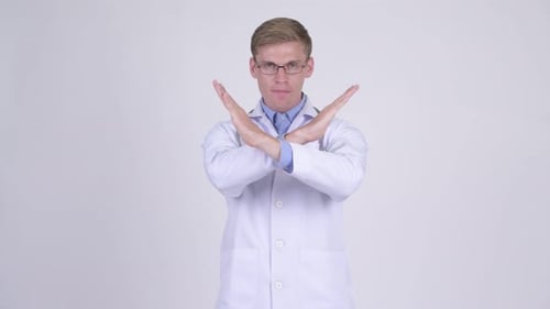 Doctor Making X Sign in Mid Shot