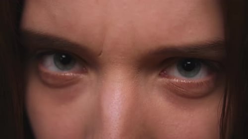 Closeup of Woman Aggressive Face Woman Has Beautiful Blue Eyes