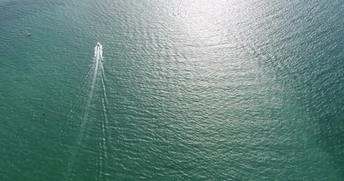 Aerial view of speed boats on the sea near beach city
