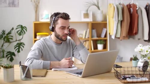 Man on Video Call at Home Office Desk