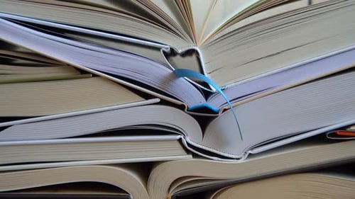Pile of Open Books in Close Up