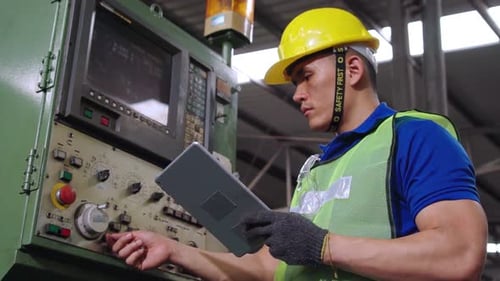 Smart Factory Worker Using Machine in Factory Workshop
