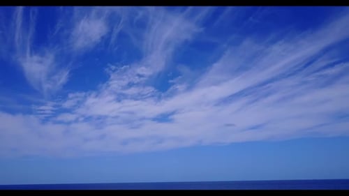 Aerial top down panorama of idyllic coastline beach lifestyle by blue sea with white sand background