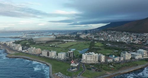 Wide Aerial Shot Tracking Forward Into the City of Cape Town During a Spectacular Sunset with Table