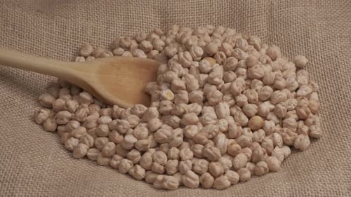 Chickpeas legume organic agriculture, wooden spoon, Mediterranean healthy food, vegan vegetarian pro