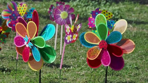 Bright Colorful Toy Windmills Are Spinning in the Wind.