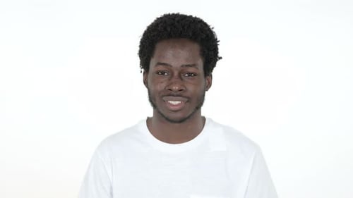 Young Adult Smiling Confidently in Studio Close Up